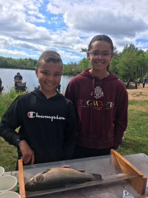 Happy fishers measure their speckled trout at the Trout-a-Rama on Cunard Pond first weekend of June.